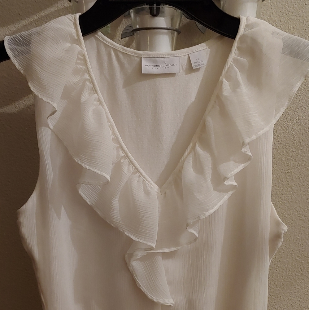 White sleeveless blouse